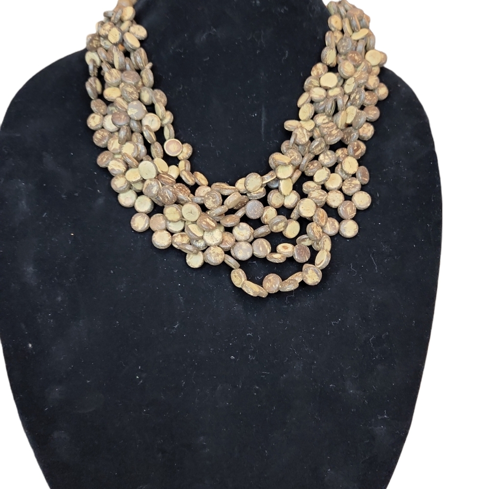 BOHO MULTI  STRAND BROWN AND TAN WOODEN LIKE BEADS WITH LARGER BEADS IN BACK